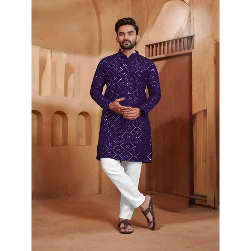 Men’s deep blue patterned kurta styled with white trousers