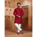 Men’s red patterned kurta styled with white trousers