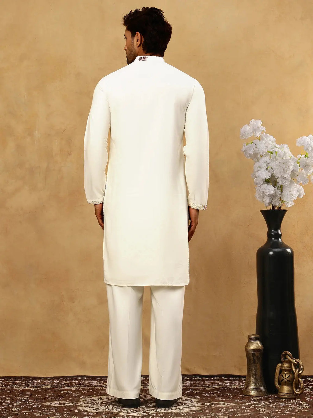 Back view of men’s cream floral kurta showing plain cream back and long sleeves