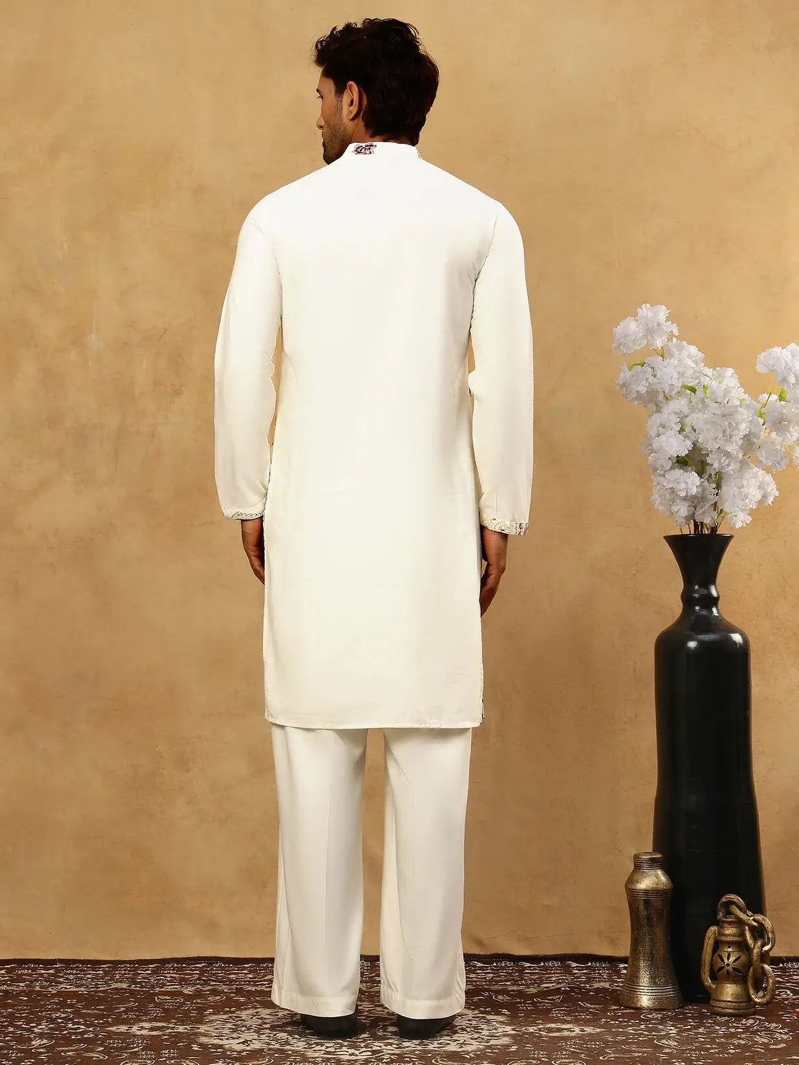 Back view of men’s cream floral kurta showing plain cream back and long sleeves