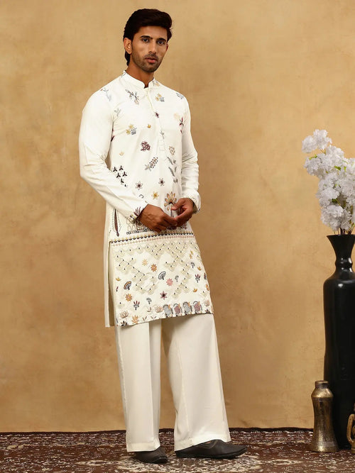 Front view of men’s cream kurta with multicoloured floral motifs and decorative lower front